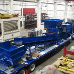 30 series quad-shaft hydrostatic shear shredder with an outfeed conveyor and collection container