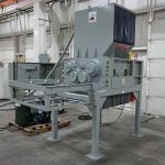 30 series quad-shaft electromechanical shear shredder with a 1.5" screen and twin planetary drives.